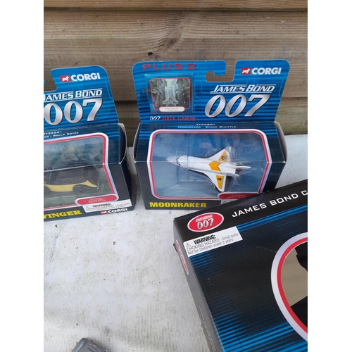 131 - Corgi James Bond related die cast toy cars, posters and replica PPK childs toy