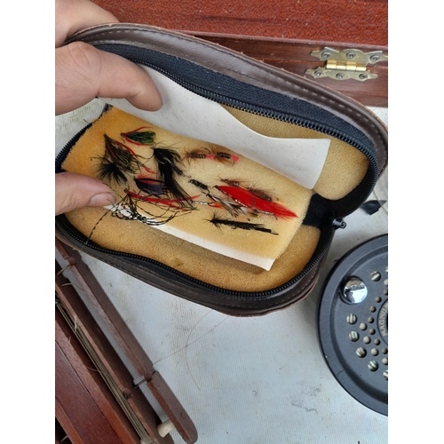 151 - Fishing interest : vintage canvas fishing bag with hand lines, fly box etc.