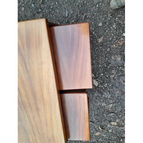 284 - Nest of mid 20th century design teak tables, colour fade to larger table 76 cms x 40 cms x 65 cms