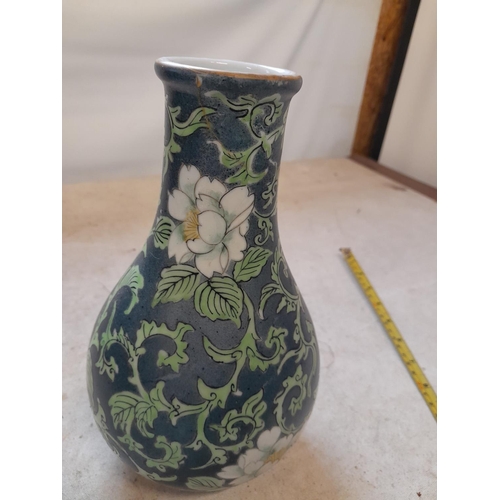 438 - Very interesting Chinese Famille Rose vase of baluster form terminating on tripod feet, with dark gr... 