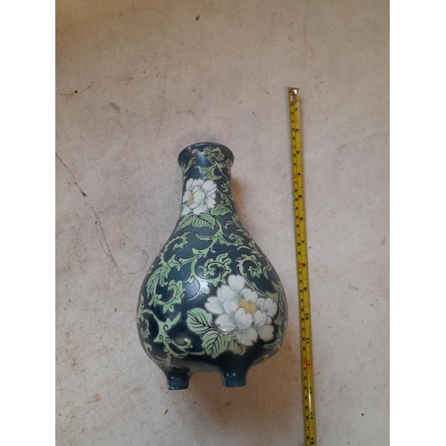 438 - Very interesting Chinese Famille Rose vase of baluster form terminating on tripod feet, with dark gr... 