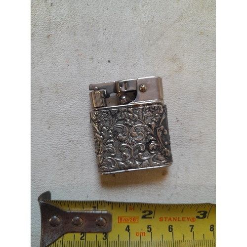 660 - Baby Myflam with foreign hallmarked silver jacket, depicting tavern scene on front and floral motifs... 
