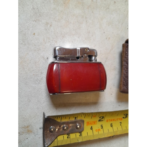 662 - Colibri Monopol pocket lighter in  leather pouch, British and World Patents Pending