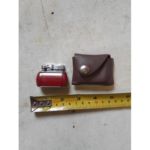 662 - Colibri Monopol pocket lighter in  leather pouch, British and World Patents Pending