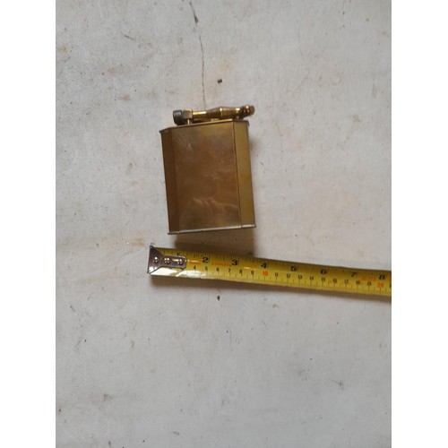 666 - Large brass table lighter with white metal eagle bird motif on front, in need of some repair, govern... 
