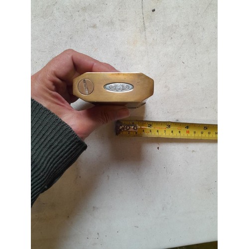 666 - Large brass table lighter with white metal eagle bird motif on front, in need of some repair, govern... 
