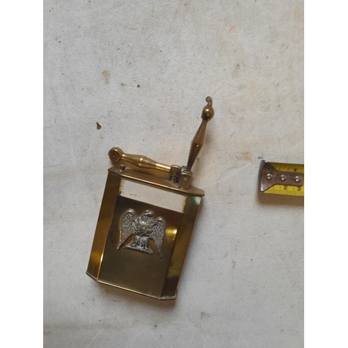 666 - Large brass table lighter with white metal eagle bird motif on front, in need of some repair, govern... 