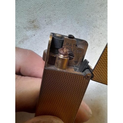 673 - Dunhill gold plated lighter retailed through Asprey & Co. Ltd New Bond Street, from the 1930s engine... 
