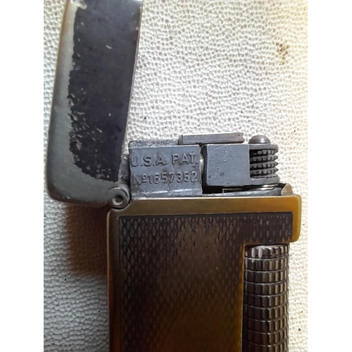 676 - Dunhill silver plated Rollalite gas lighter US Pat 16757352