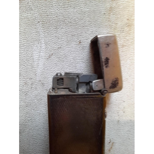 676 - Dunhill silver plated Rollalite gas lighter US Pat 16757352