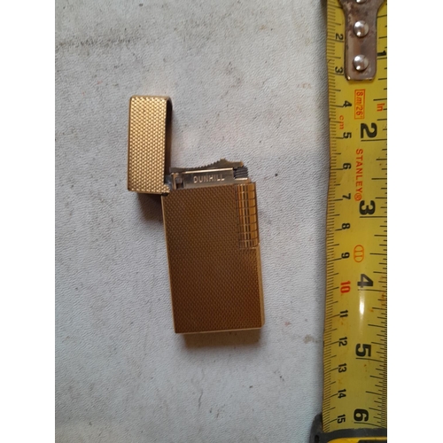 677 - Dunhill gold plated gas lighter with engine turned decoration, made in England on internal cap in ne... 