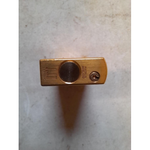 677 - Dunhill gold plated gas lighter with engine turned decoration, made in England on internal cap in ne... 