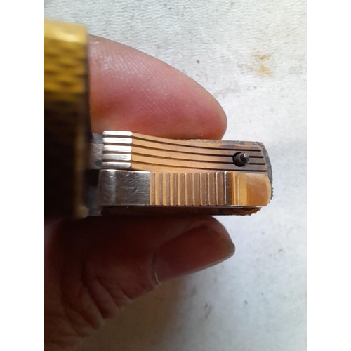 677 - Dunhill gold plated gas lighter with engine turned decoration, made in England on internal cap in ne... 