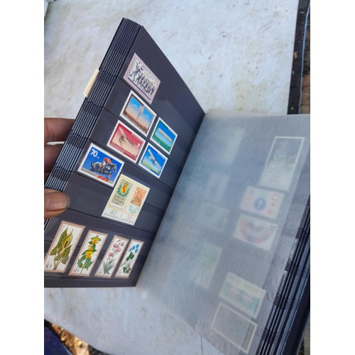 57 - 14 albums and stocks of post war Stamps of Germany, some mounted mint and used  and some loose in ti... 