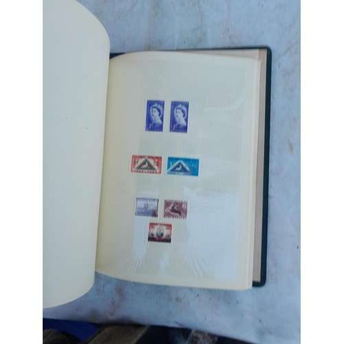 75 - Random array of GB, Commonwealth and stamps of the world, mint and used in 8 albums