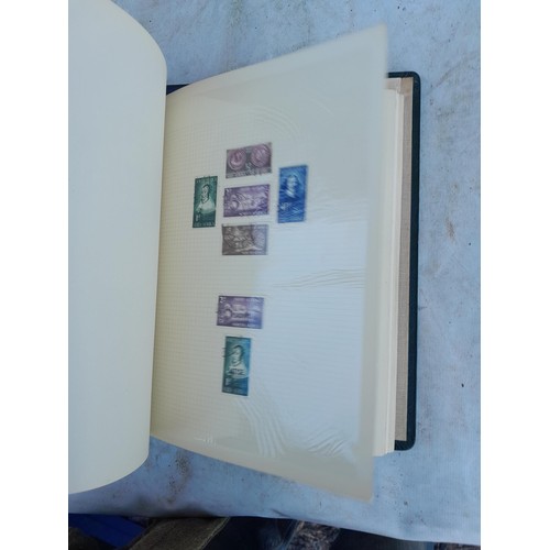 75 - Random array of GB, Commonwealth and stamps of the world, mint and used in 8 albums