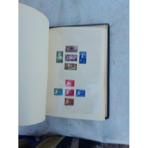 75 - Random array of GB, Commonwealth and stamps of the world, mint and used in 8 albums