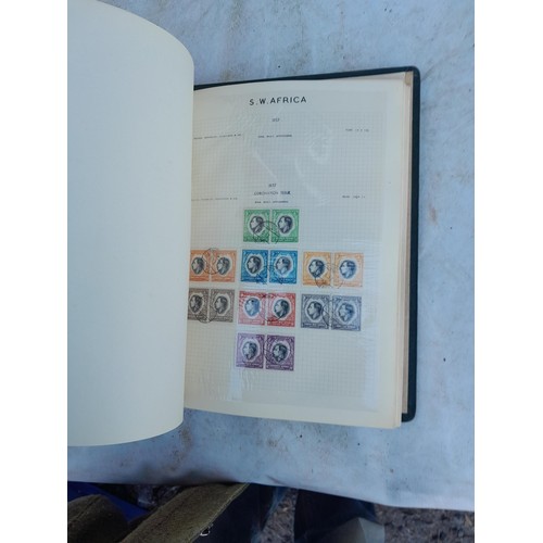 75 - Random array of GB, Commonwealth and stamps of the world, mint and used in 8 albums