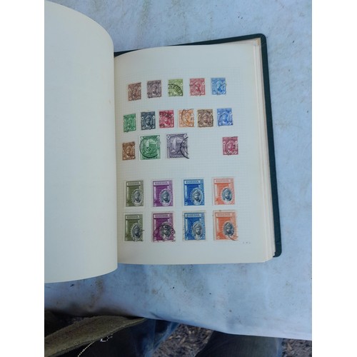 75 - Random array of GB, Commonwealth and stamps of the world, mint and used in 8 albums