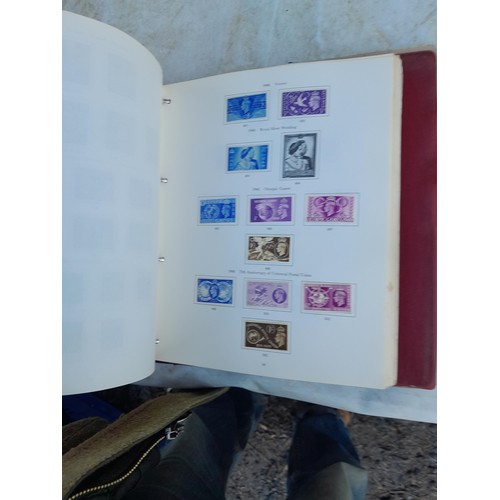 75 - Random array of GB, Commonwealth and stamps of the world, mint and used in 8 albums