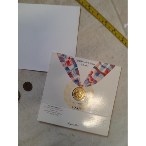 182 - Coins : 1986 Olympic £2 coin presentation pack with other coins