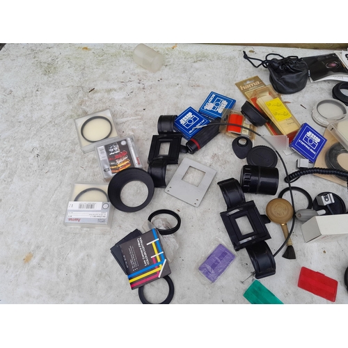 99 - Collection of assorted camera accessories, lens filters etc.