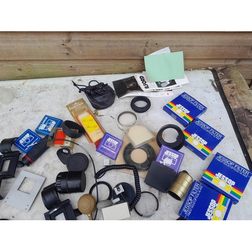 99 - Collection of assorted camera accessories, lens filters etc.