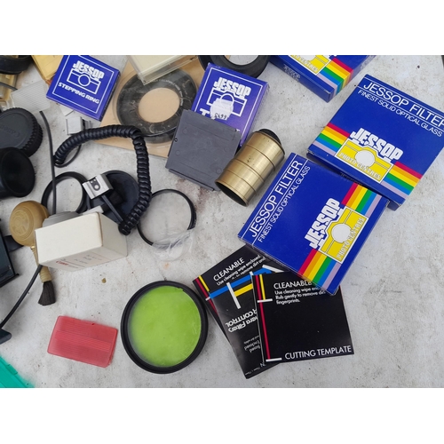 99 - Collection of assorted camera accessories, lens filters etc.