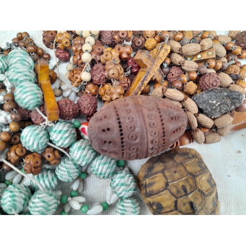 15 - Basket of costume jewellery, pierced and carved wooden egg etc.