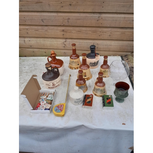 39 - An Array of mainly Wade and advertising empty whisky bottles and some related china and glass