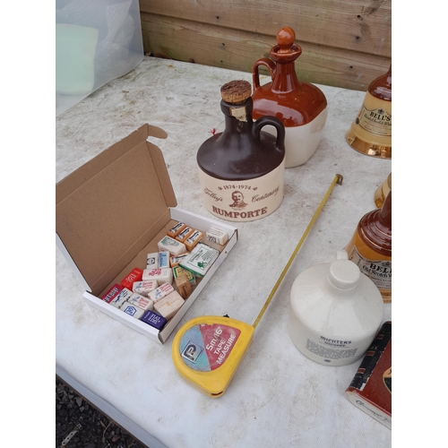 39 - An Array of mainly Wade and advertising empty whisky bottles and some related china and glass