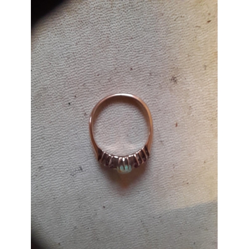 41 - Unmarked but test 9 ct gold ring set with opal and rubies, missing one stone size N 2.8 g in present... 