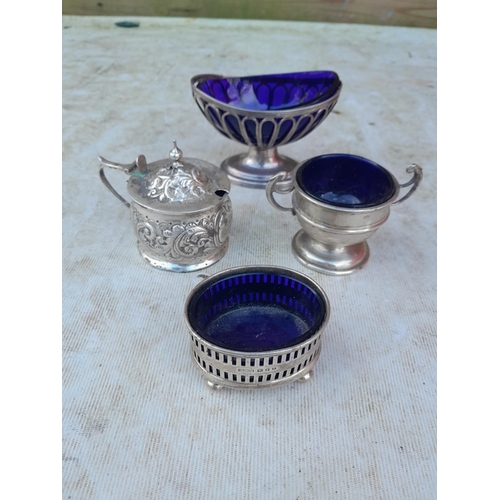 535 - 4 x silver salts with blue glass liners, different dates, assay offices and makers