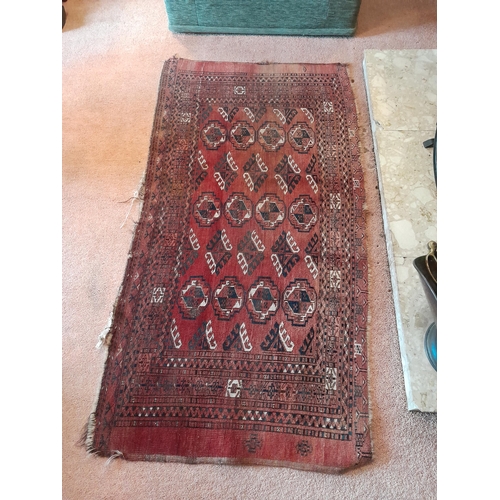 11 - Early 20th century Persian rug worn in places 150 cms x 77 cms