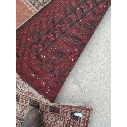 51 - Early 20th century hand woven Persian rug faded 183cms x  104 cms