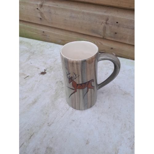 562 - Studio Pottery tankard decorated with deer