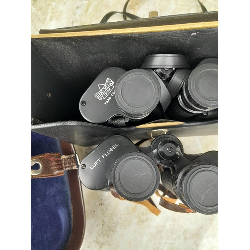 28 - 2 x pairs of binoculars : 1 x Hans Weiss 10 x 50 , Luft Flugel  7 x 50