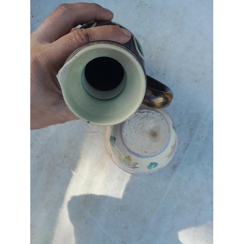 79 - Doulton stoneware jug with restored base and Art Pottery (Omega Pottery Style) cup with damages