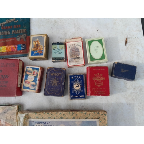 190 - Vintage toys and games : playing cards, jigsaws, marbles etc.