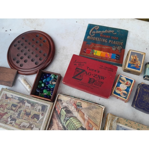 190 - Vintage toys and games : playing cards, jigsaws, marbles etc.