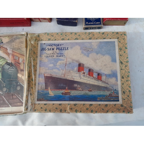 190 - Vintage toys and games : playing cards, jigsaws, marbles etc.