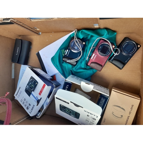 212 - Collection of modern digital cameras, some with boxes of issue and paperwork and accessories