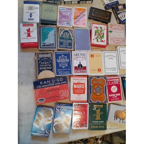 215 - Collection of assorted era playing cards and whist marker, some packs still sealed