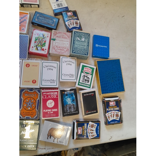 215 - Collection of assorted era playing cards and whist marker, some packs still sealed