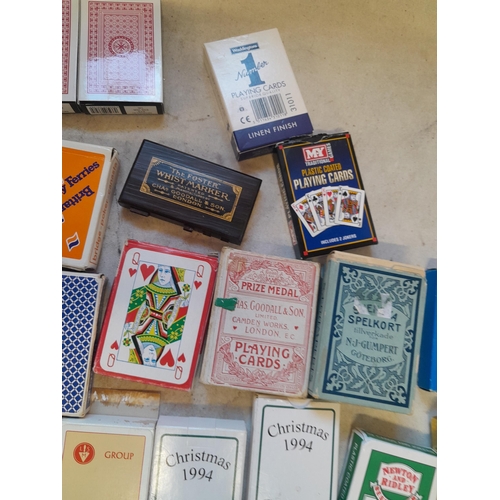 215 - Collection of assorted era playing cards and whist marker, some packs still sealed