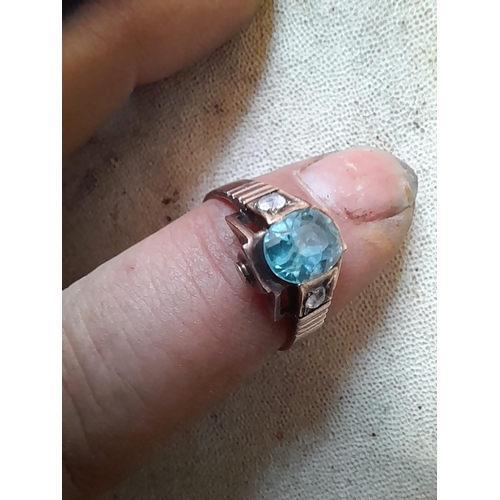 261 - Unmarked but tested 9 ct rose gold ring set with aqua marine and paste size P, 3.7 g