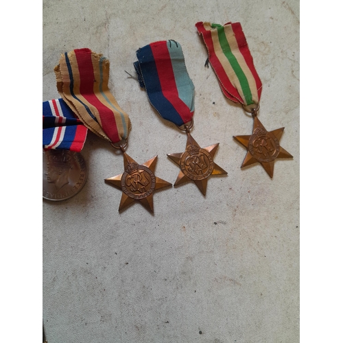 302 - Collection of unnamed Word War II medals possibly pertaining to  Peter Young or relatives along with... 