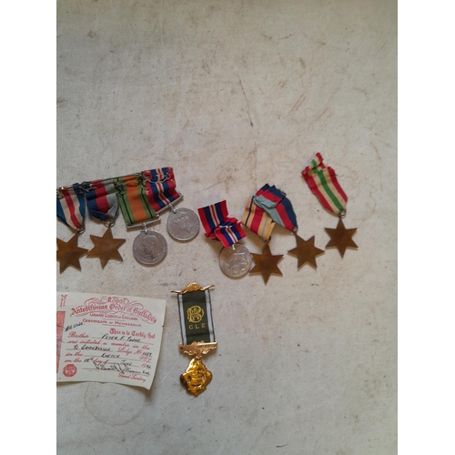 302 - Collection of unnamed Word War II medals possibly pertaining to  Peter Young or relatives along with... 