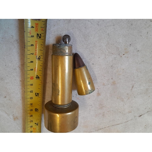 564 - World War II era trench art petrol table top lighter fashioned from anti aircraft bullet