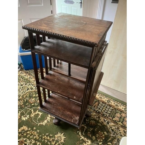 673 - Early 20th century oak revolving bookcase on later ball castors with fold down tray Dimensions 52cm ... 